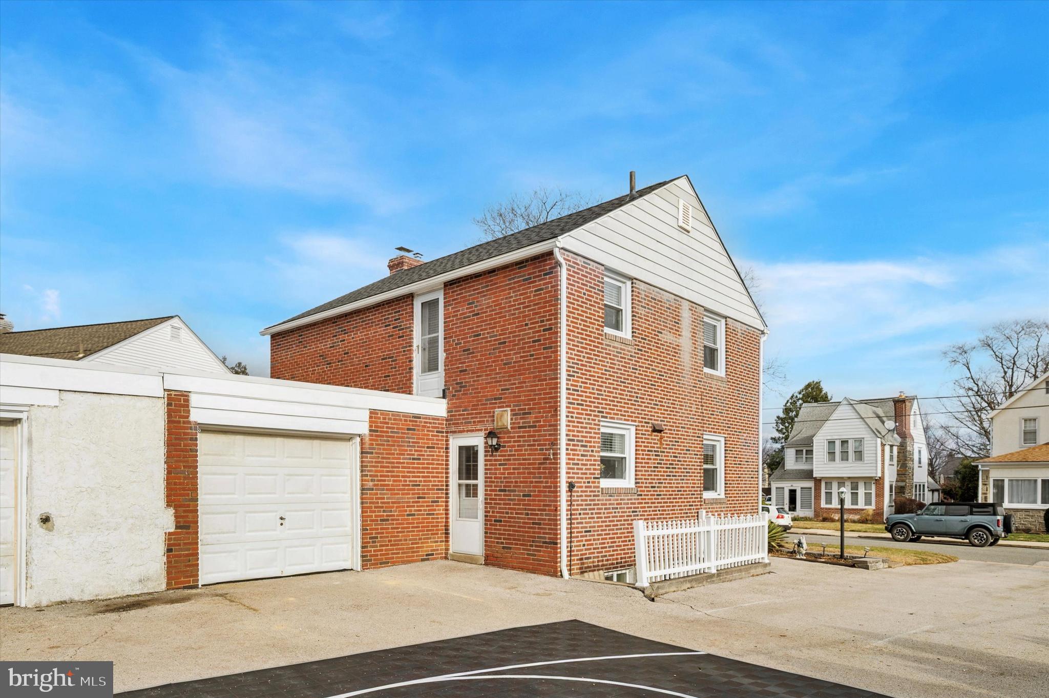 24 Upland Road Havertown, PA 19083 - Photo 25 of 28 a front view of a building with a road