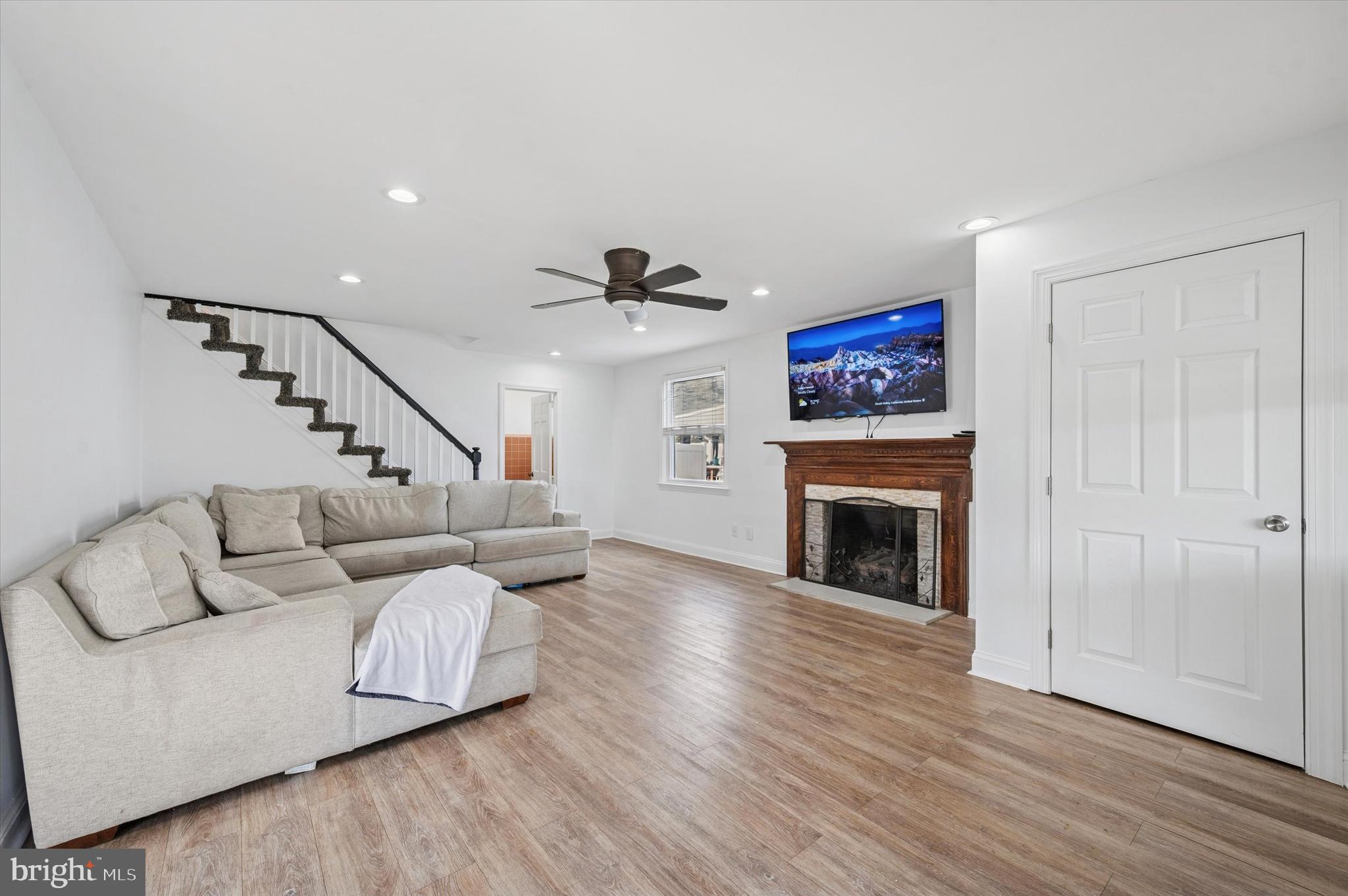 24 Upland Road Havertown, PA 19083 - Photo 5 of 28 a living room with furniture and a fireplace