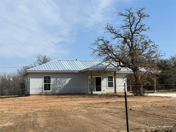 front view of a house with a big yard
