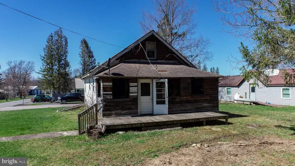 a front view of a house with yard