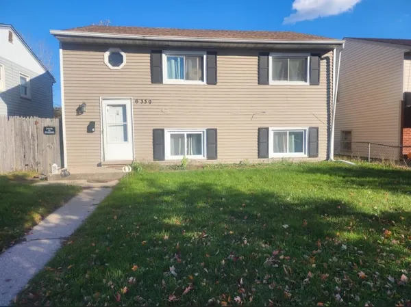 a house view with a garden space