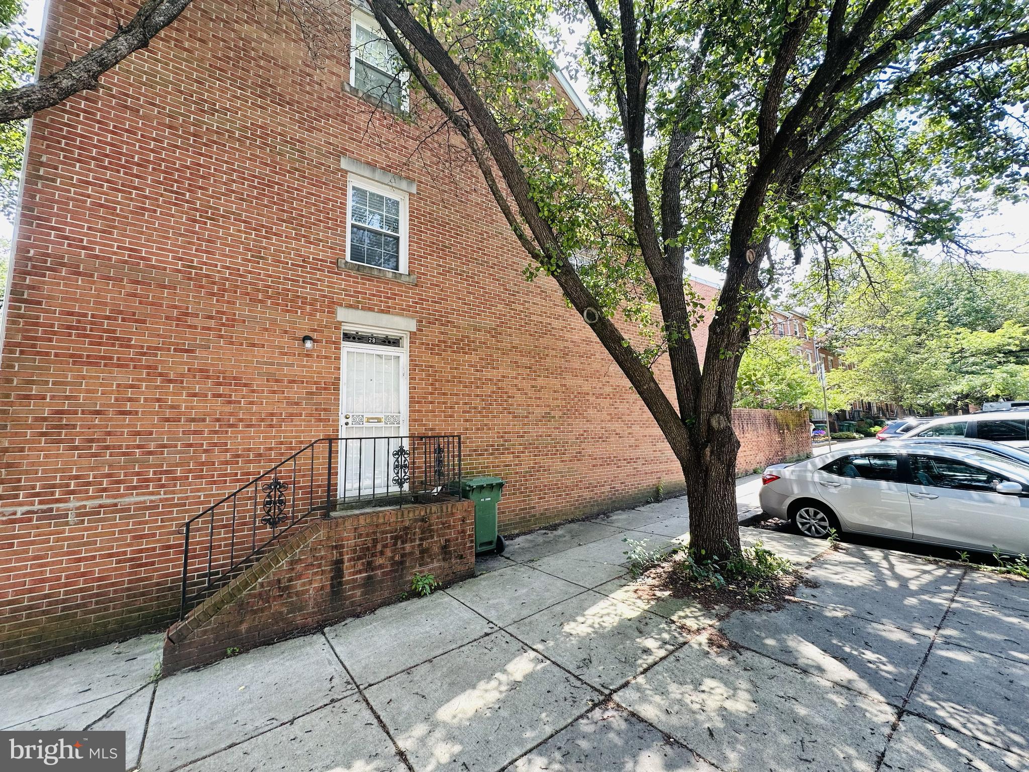 28 North Wolfe Street Baltimore, MD 21231 - Photo 2 of 25 a view of a house with a yard