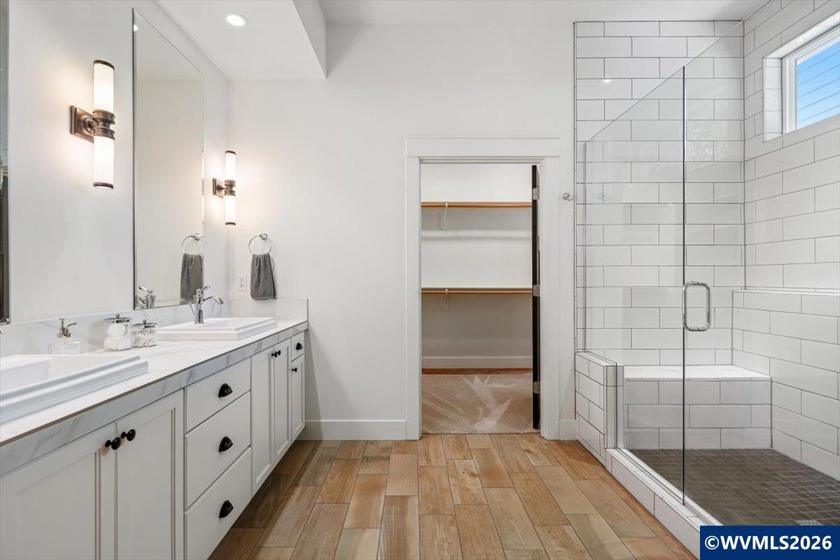 1115 Southwest Sylvia Street Corvallis, OR 97333 - Photo 12 of 22 a spacious bathroom with a granite countertop sink a toilet and shower