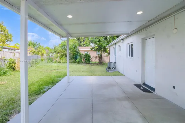 a view of a porch with a backyard