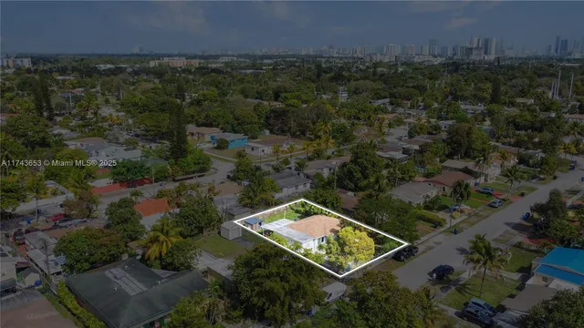 an aerial view of house with yard