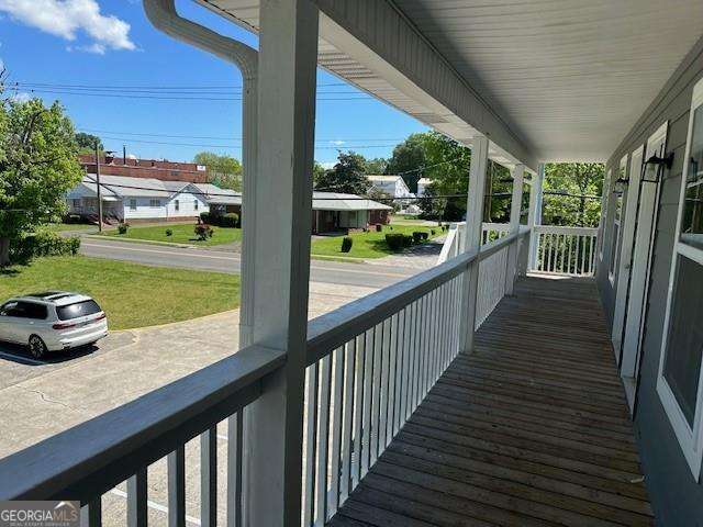 432 4th Avenue Dalton, GA 30721 - Photo 16 of 25 a view of a porch with furniture and garden