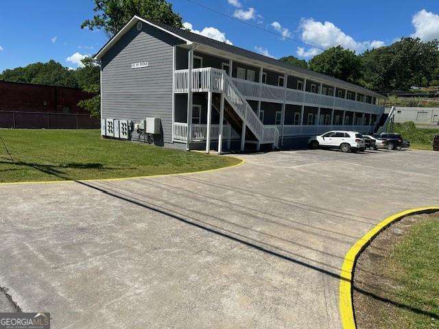 432 4th Avenue Dalton, GA 30721 - Photo 20 of 25 a front view of a house with a yard