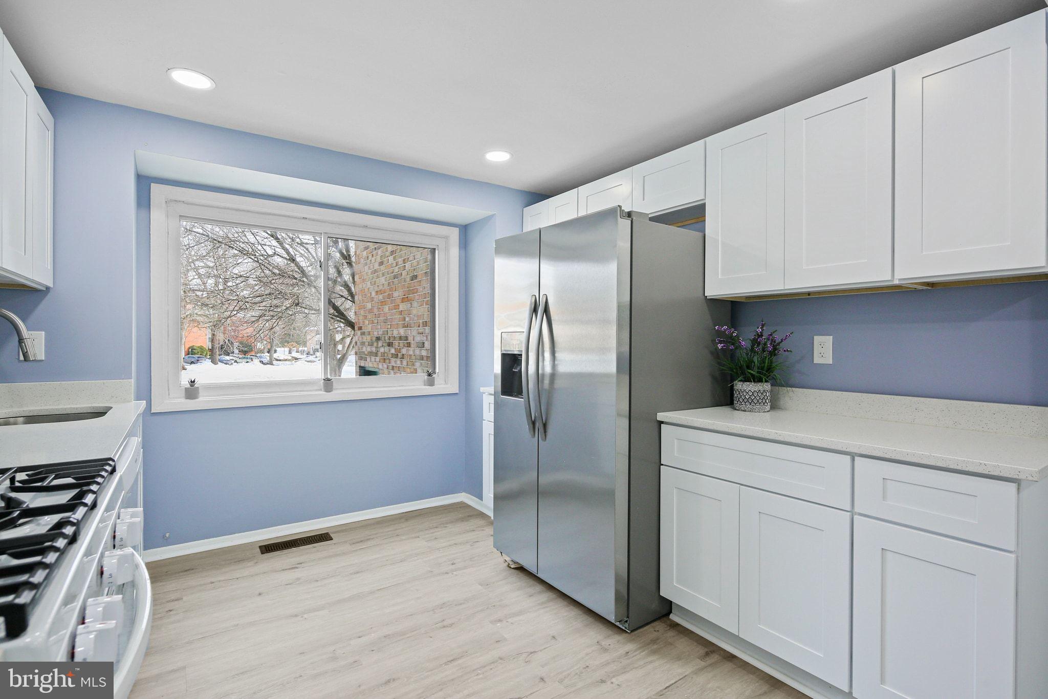 9411 Merryrest Road, Unit B Columbia, MD 21045 - Photo 2 of 25 Stainless fridge, recessed lights & LVP flooring