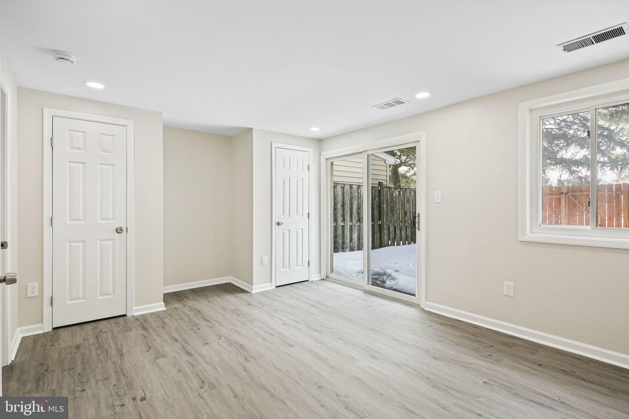 9411 Merryrest Road, Unit B Columbia, MD 21045 - Photo 8 of 25 Lower level bdrm w/ patio access, 2 closets