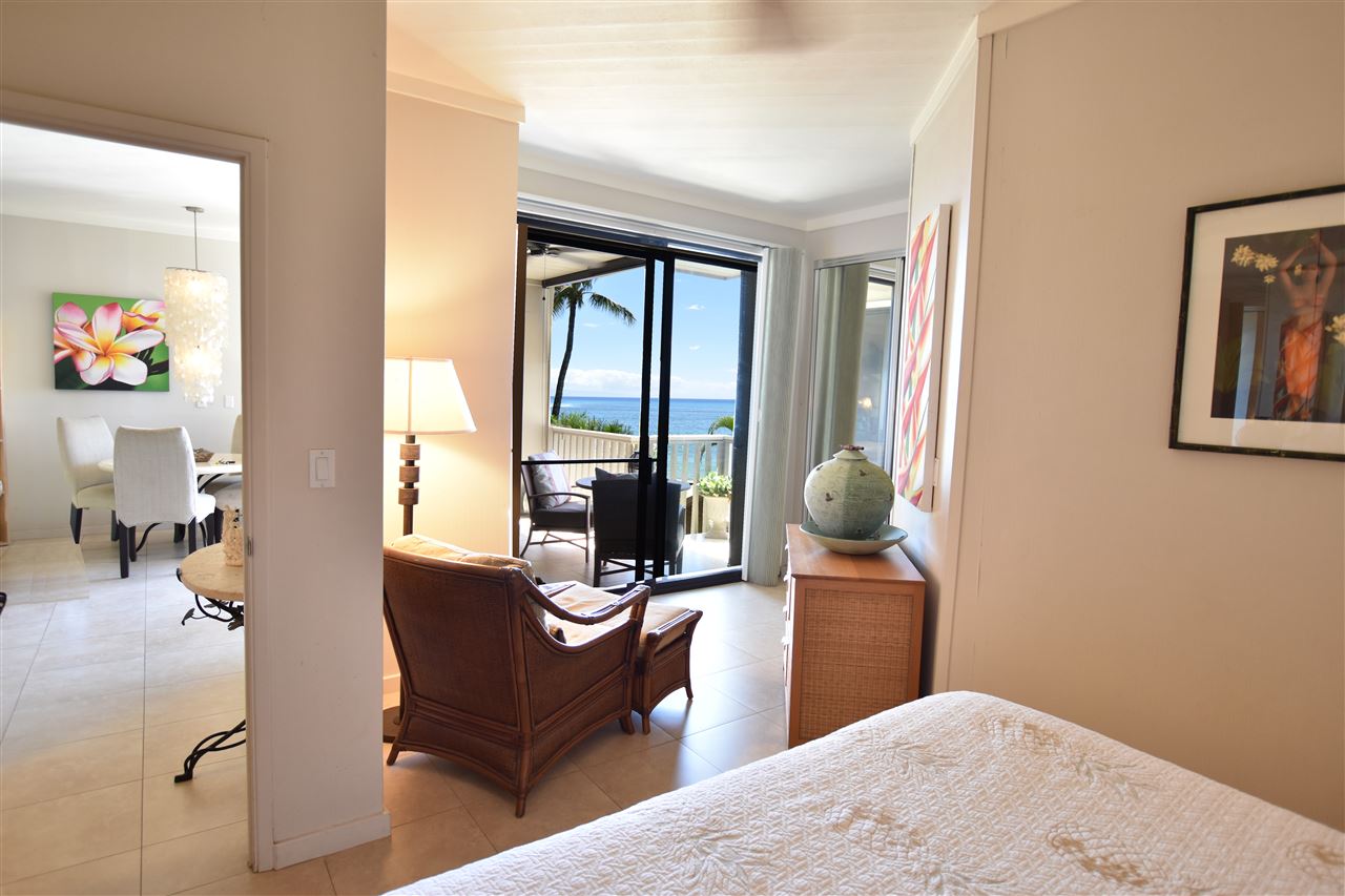 4435 Lower Honoapiilani Road, Unit 204 Lahaina, HI 96761 - Photo 12 of 23 a living room with furniture and a large window