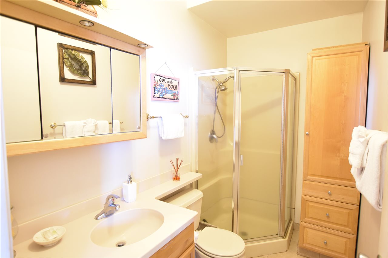 4435 Lower Honoapiilani Road, Unit 204 Lahaina, HI 96761 - Photo 13 of 23 a bathroom with a sink and a mirror