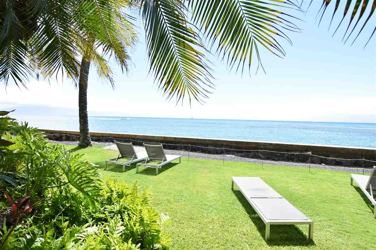 4435 Lower Honoapiilani Road, Unit 204 Lahaina, HI 96761 - Photo 16 of 23 a view of a swimming pool with a garden and trees