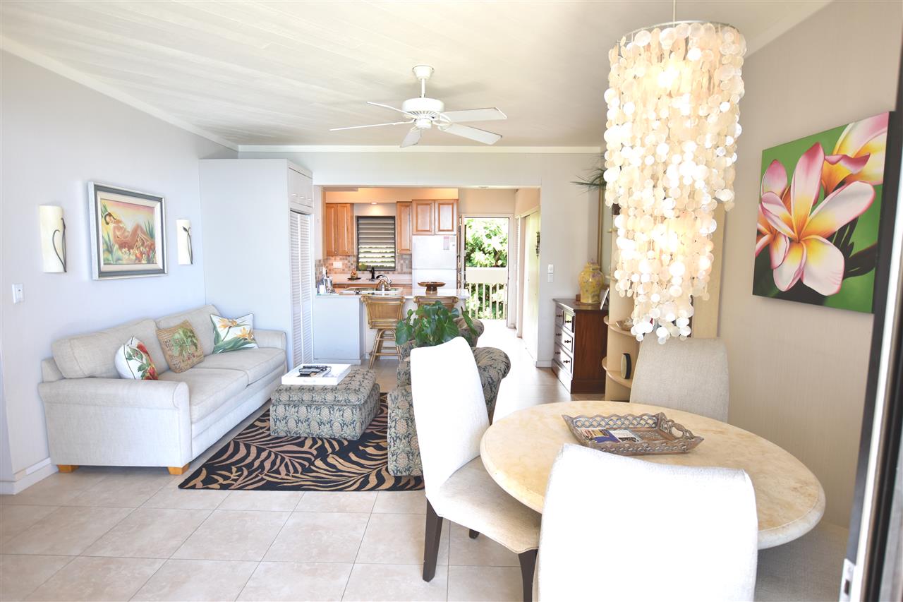 4435 Lower Honoapiilani Road, Unit 204 Lahaina, HI 96761 - Photo 6 of 23 a living room with furniture and a chandelier