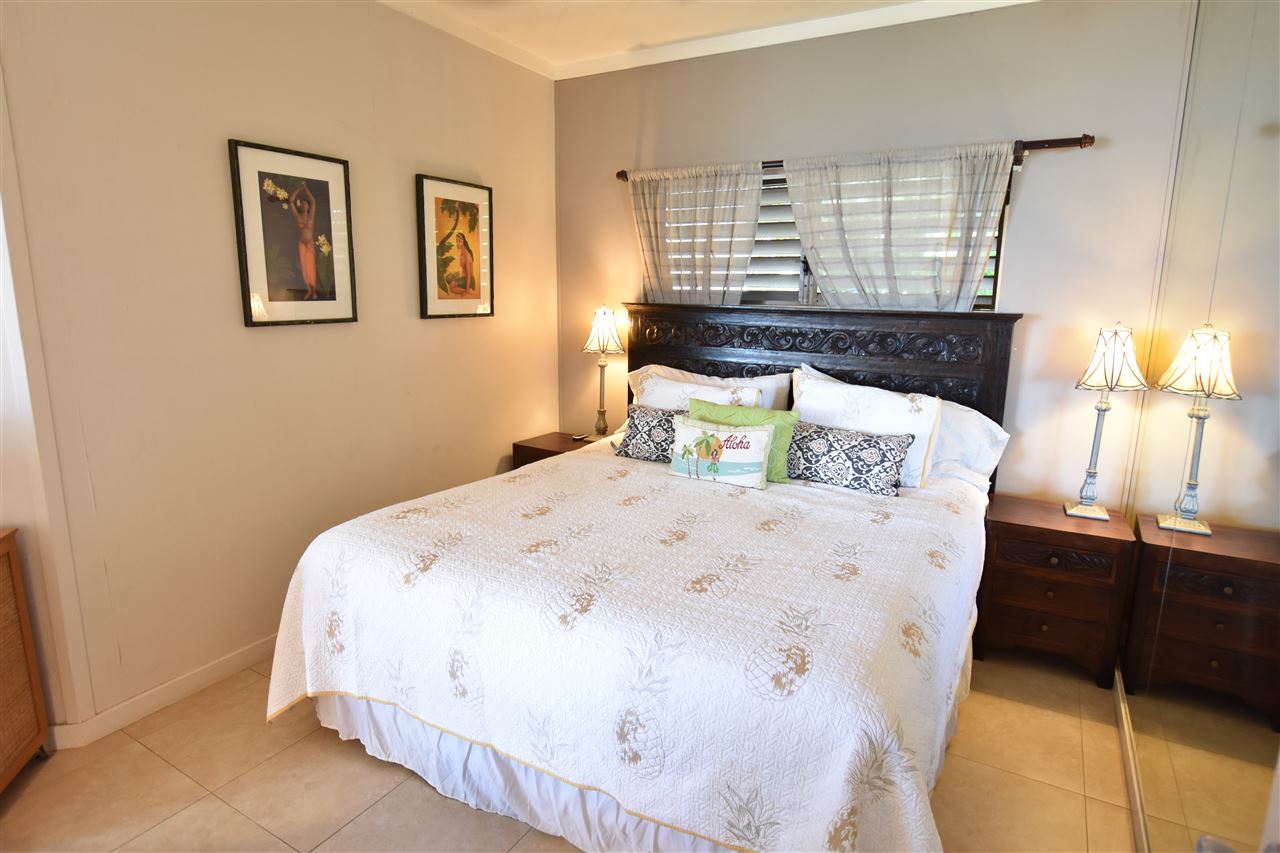4435 Lower Honoapiilani Road, Unit 204 Lahaina, HI 96761 - Photo 10 of 23 a bed sitting in a bedroom next to a window