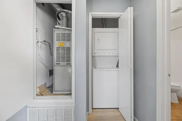 a view of a bathroom from a corridor