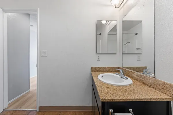 a bathroom with a sink and a mirror
