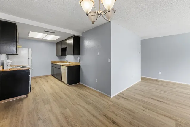 a view of kitchen with sink microwave and stove