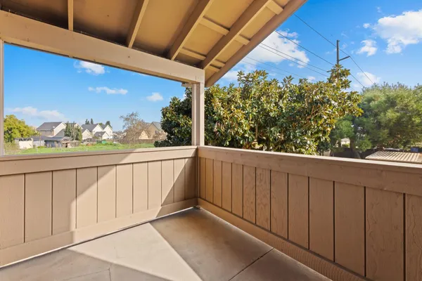 a view of balcony with furniture