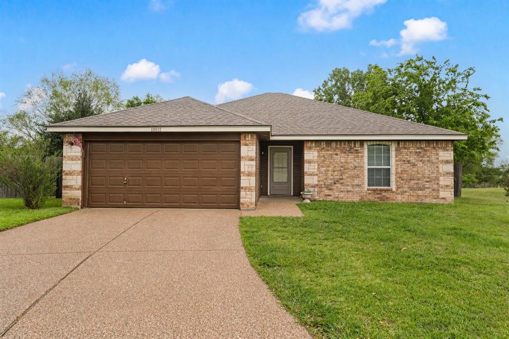 10512 Granada Drive Waco, TX 76708 - Photo 1 of 22 a front view of a house with a yard and garage