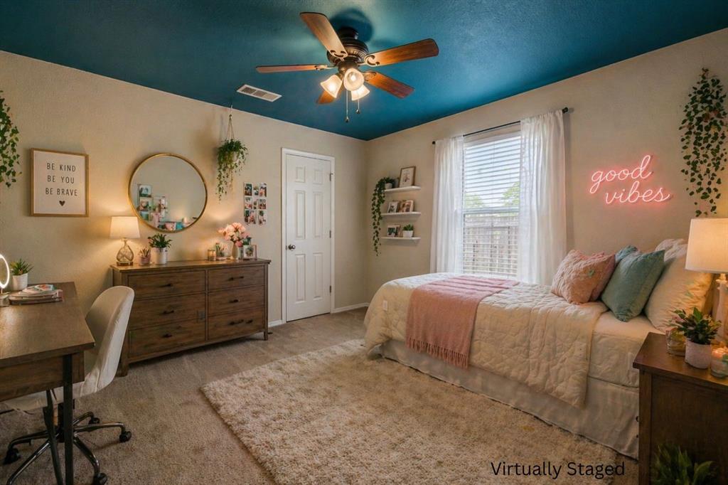 10512 Granada Drive Waco, TX 76708 - Photo 14 of 22 a bedroom with a bed and a dresser next to a window