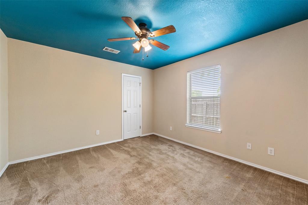 10512 Granada Drive Waco, TX 76708 - Photo 15 of 22 an empty room with window and ceiling fan