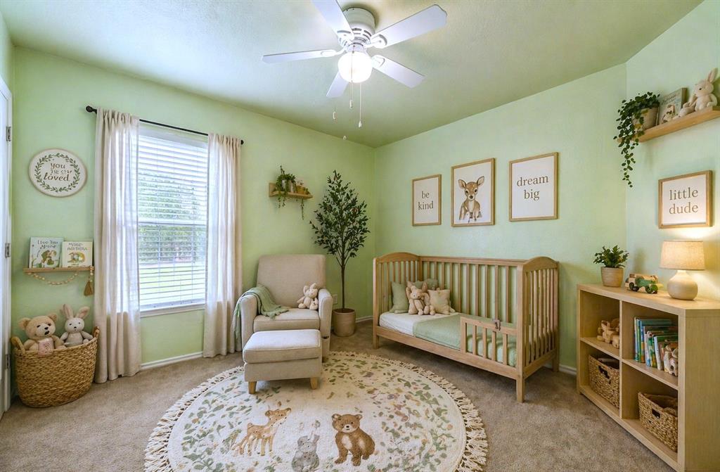 10512 Granada Drive Waco, TX 76708 - Photo 17 of 22 a bedroom with a bed and a chandelier