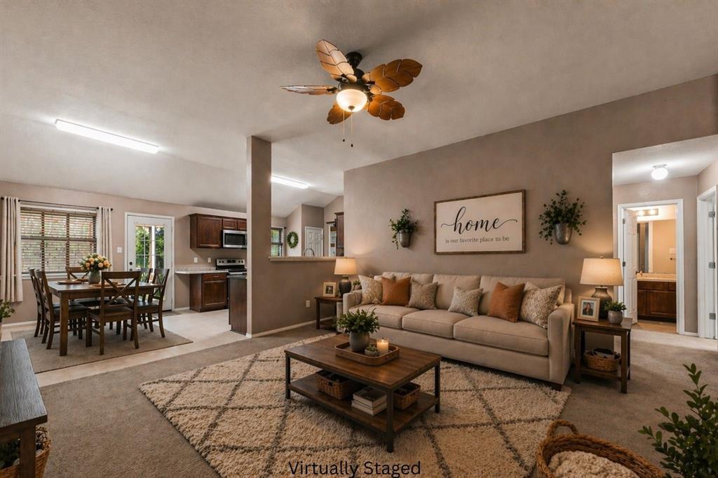 10512 Granada Drive Waco, TX 76708 - Photo 2 of 22 a living room with furniture a dining table and a piano table
