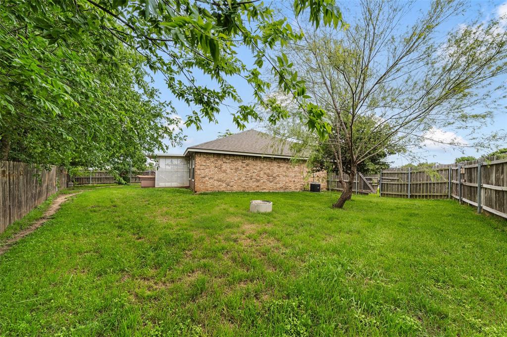 10512 Granada Drive Waco, TX 76708 - Photo 21 of 22 a view of a backyard with large trees