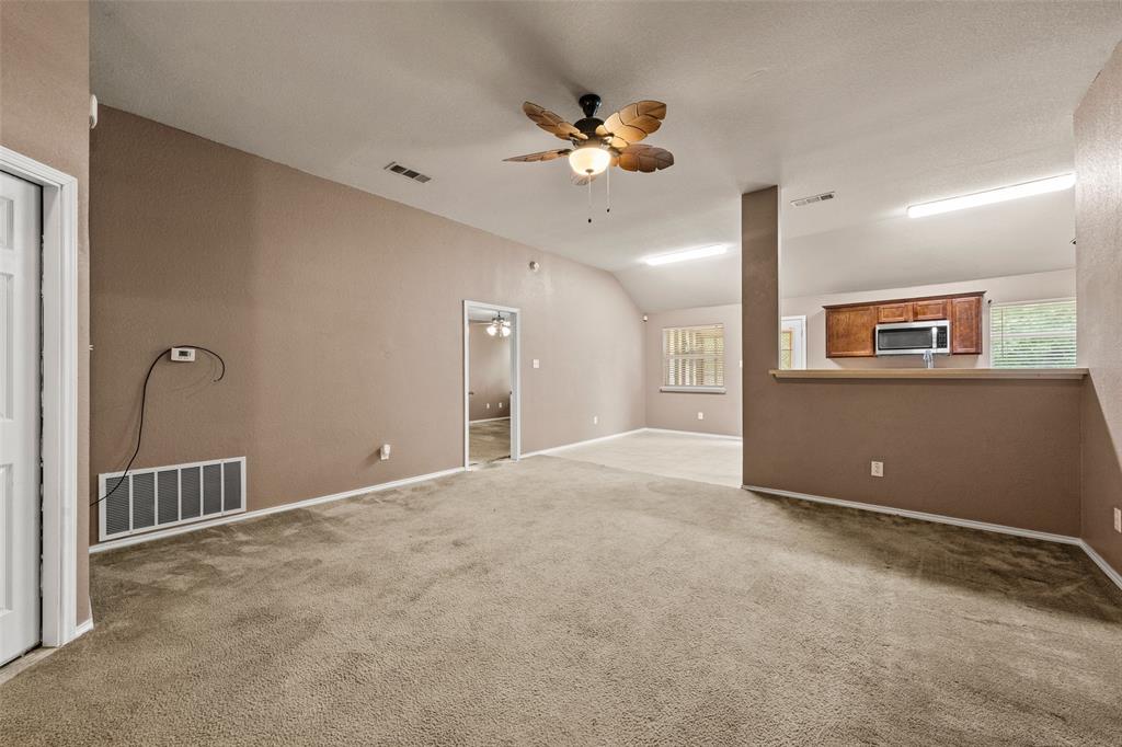 10512 Granada Drive Waco, TX 76708 - Photo 4 of 22 a view of an empty room with a ceiling fan