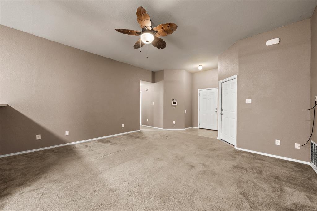10512 Granada Drive Waco, TX 76708 - Photo 5 of 22 an empty room and chandelier fan