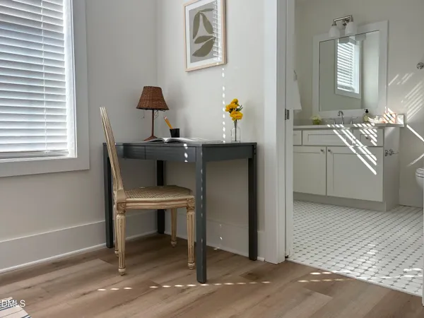 a workspace with furniture and window