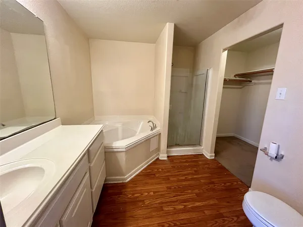 a bathroom with a bathtub and a toilet
