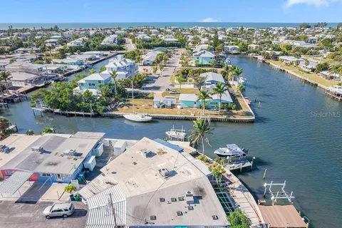 a view of a hall with wooden floor and a rug