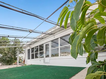 a view of a room with wooden walls and stairs