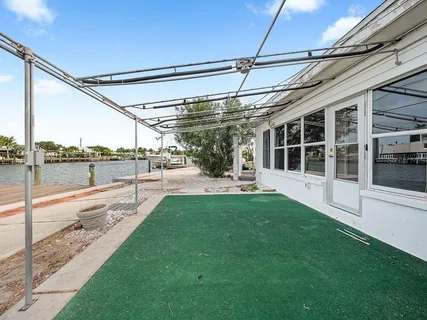 a view of a patio with a table and chairs