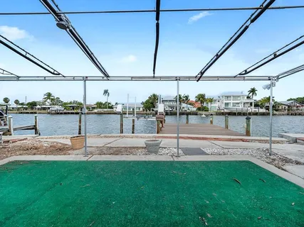 an aerial view of a house with a lake view