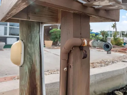 an aerial view of a house with a yard swimming pool and outdoor seating