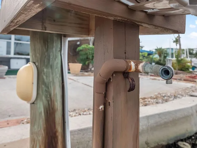 an aerial view of a house with a yard swimming pool and outdoor seating
