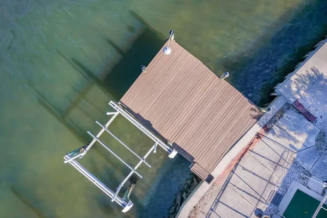 an aerial view of a house with outdoor space