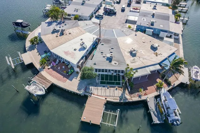 an aerial view of a residential houses with outdoor space