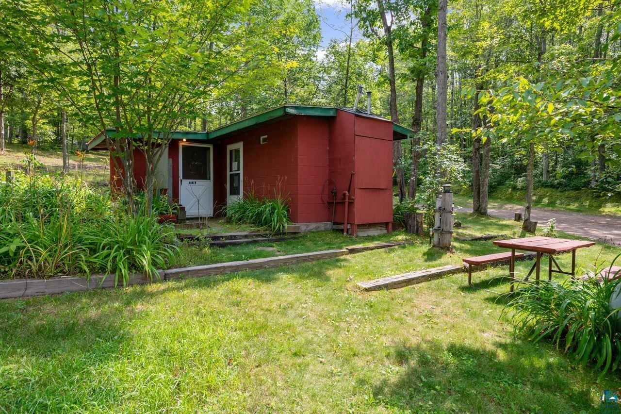 9505 Wildwood Campground Road Iron River, WI 54847 - Photo 17 of 34 Exterior space with a lawn