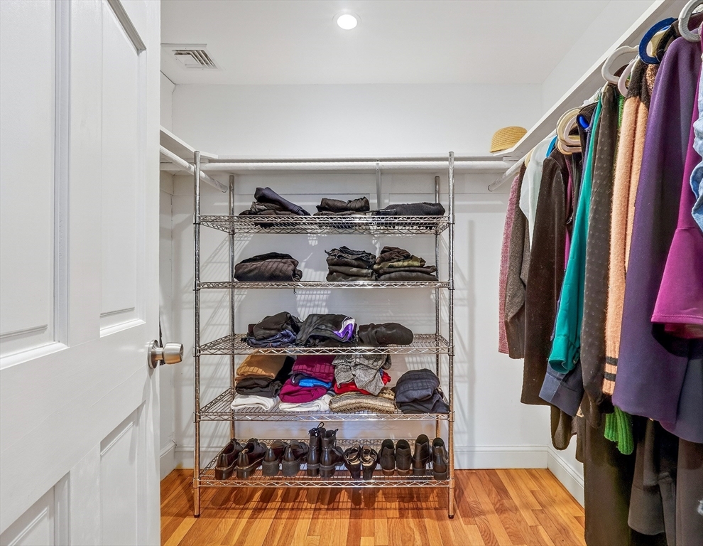 87 Payson Road Brookline, MA 02467 - Photo 24 of 41 a view of walk in closet with clothes and shoes