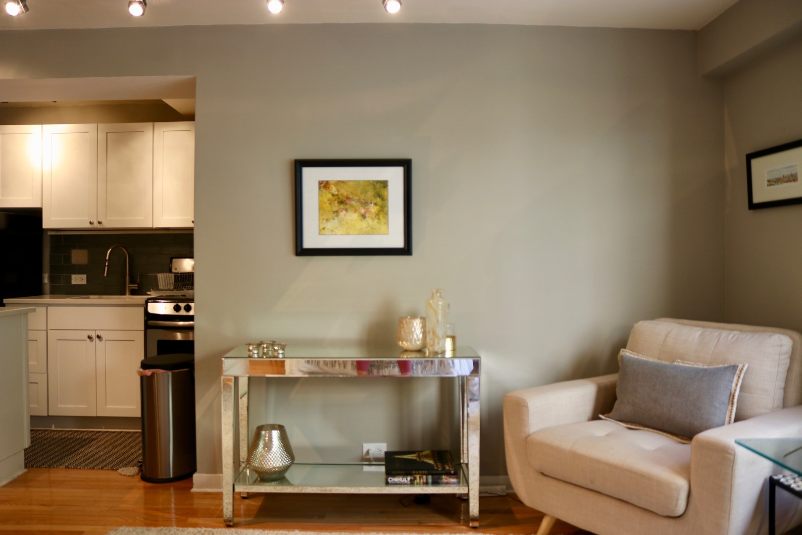 2909 North Sheridan Road, Unit 201 Chicago, IL 60657 - Photo 11 of 18 a room with a couch and a view of kitchen