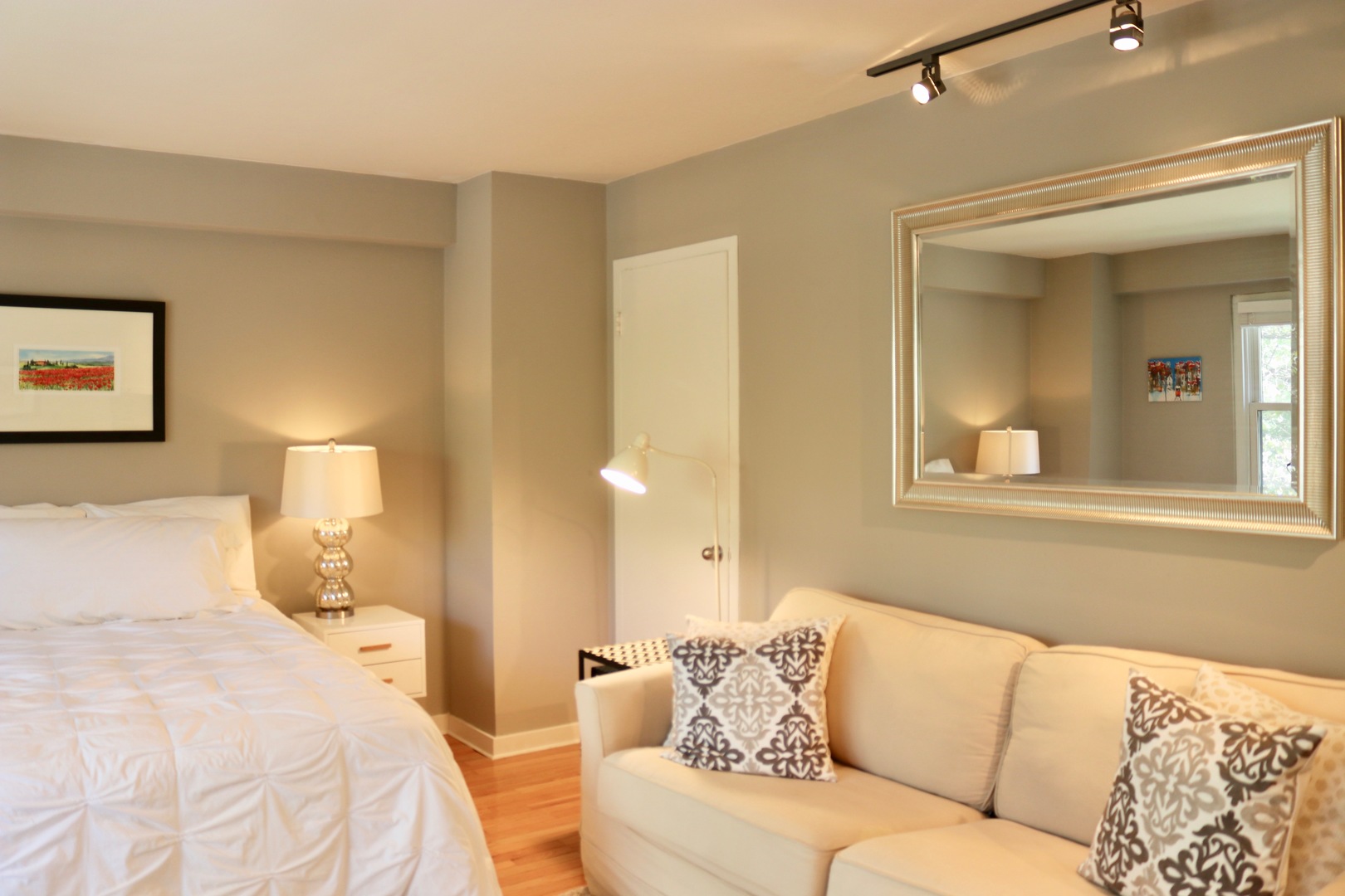2909 North Sheridan Road, Unit 201 Chicago, IL 60657 - Photo 7 of 18 a bedroom with a bed and couch