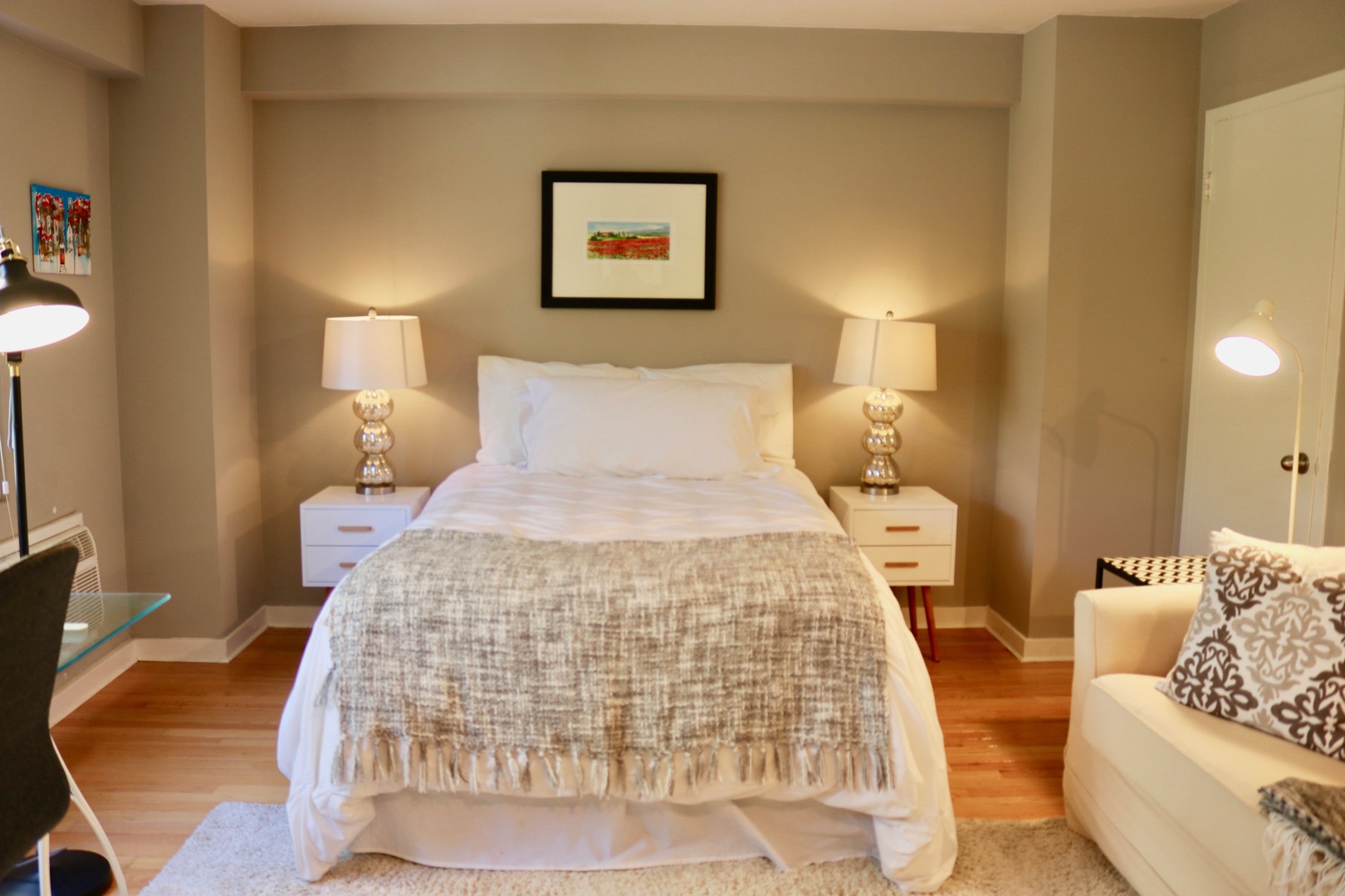 2909 North Sheridan Road, Unit 201 Chicago, IL 60657 - Photo 9 of 18 a bedroom with a bed and a couch