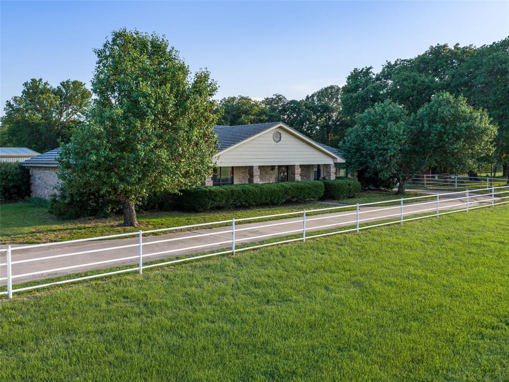 449 Private Road 4670 Rhome, TX 76078 - Photo 14 of 39 a view of an house with a yard