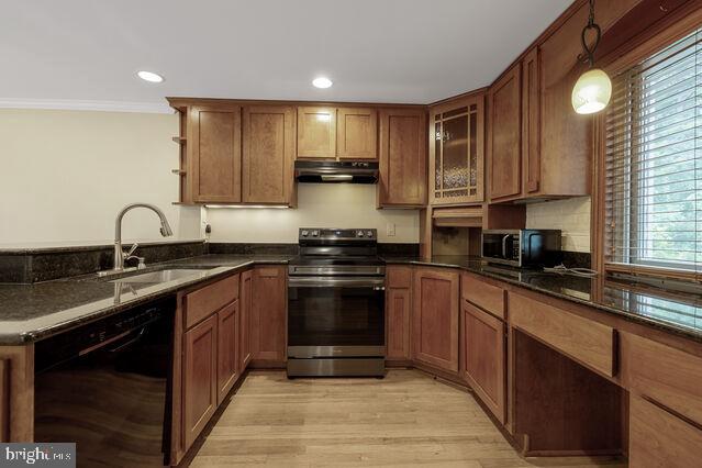19621 Sparr Spring Road Montgomery Village, MD 20886 - Photo 15 of 18 a kitchen with stainless steel appliances granite countertop a sink stove and cabinets