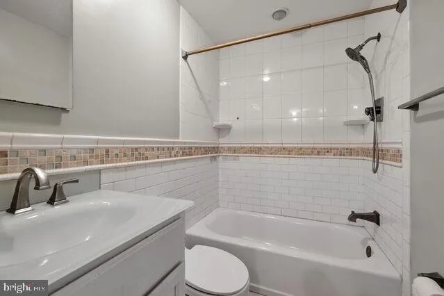 a bathroom with a sink a toilet and a bathtub