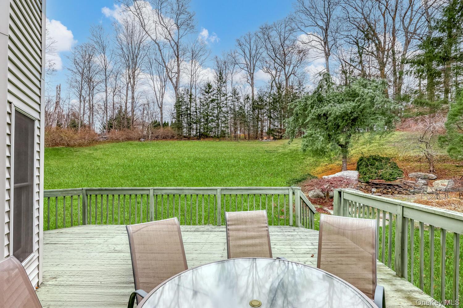 22 Golden Road Suffern, NY 10901 - Photo 8 of 41 Deck featuring outdoor dining space and a lawn