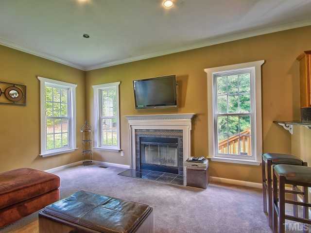 8008 Mill Bluff Court Raleigh, NC 27616 - Photo 11 of 25 a living room with furniture and a fireplace